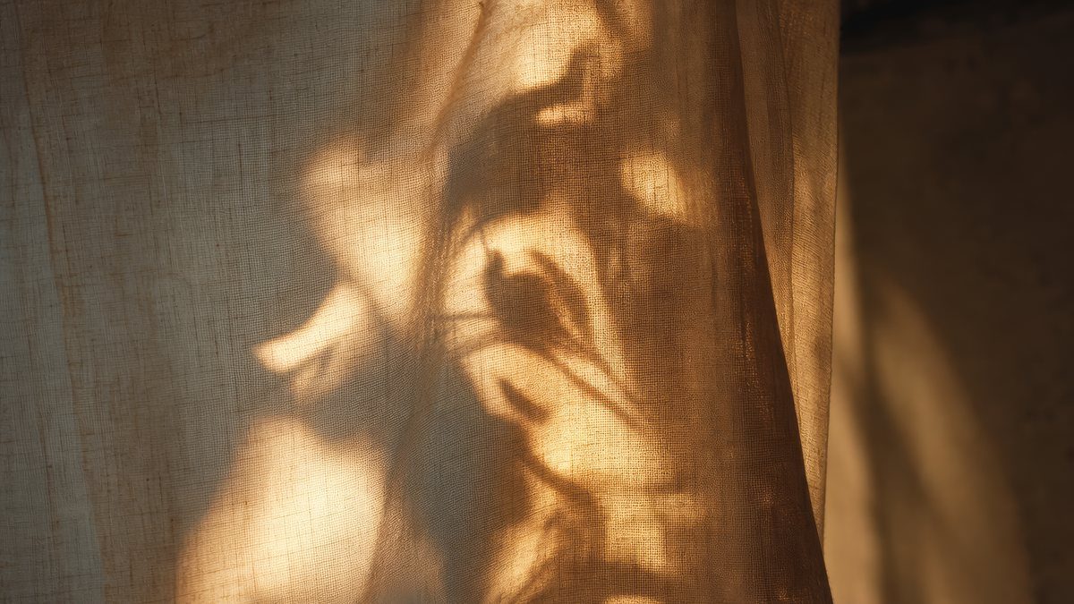 Soft daylight through a linen curtain
